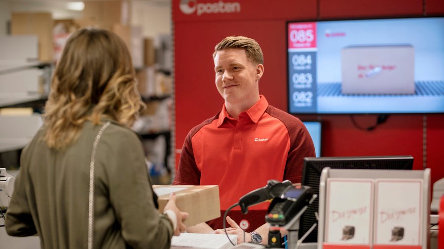 Woman delivering a parcel at the post office
