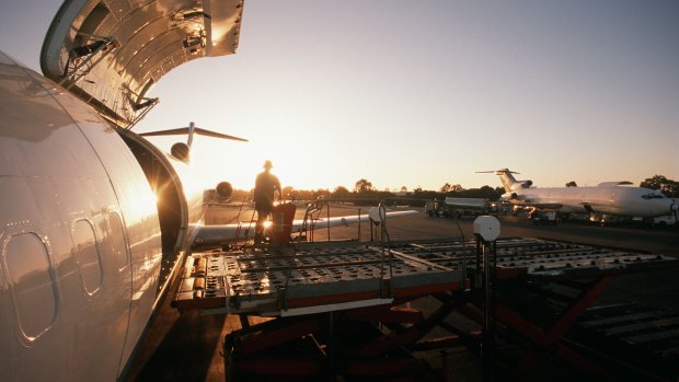 Loading on an airplane in the evening sun
